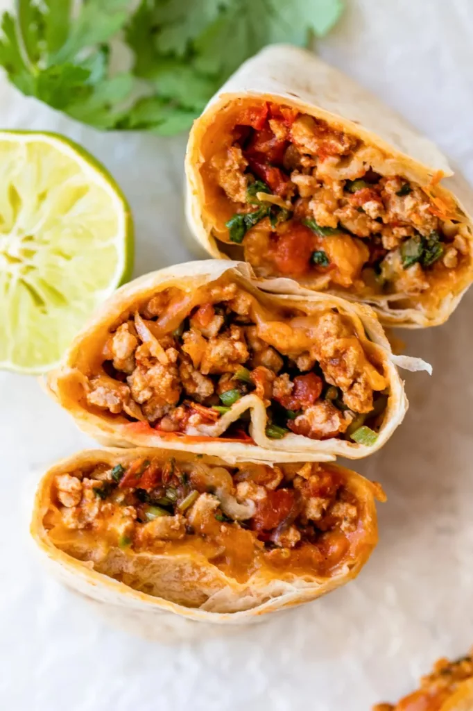 This healthier version of Meximelt is made with ground turkey seasoned with my own taco flavor and served inside a tortilla with pico de gallo and melted cheese.