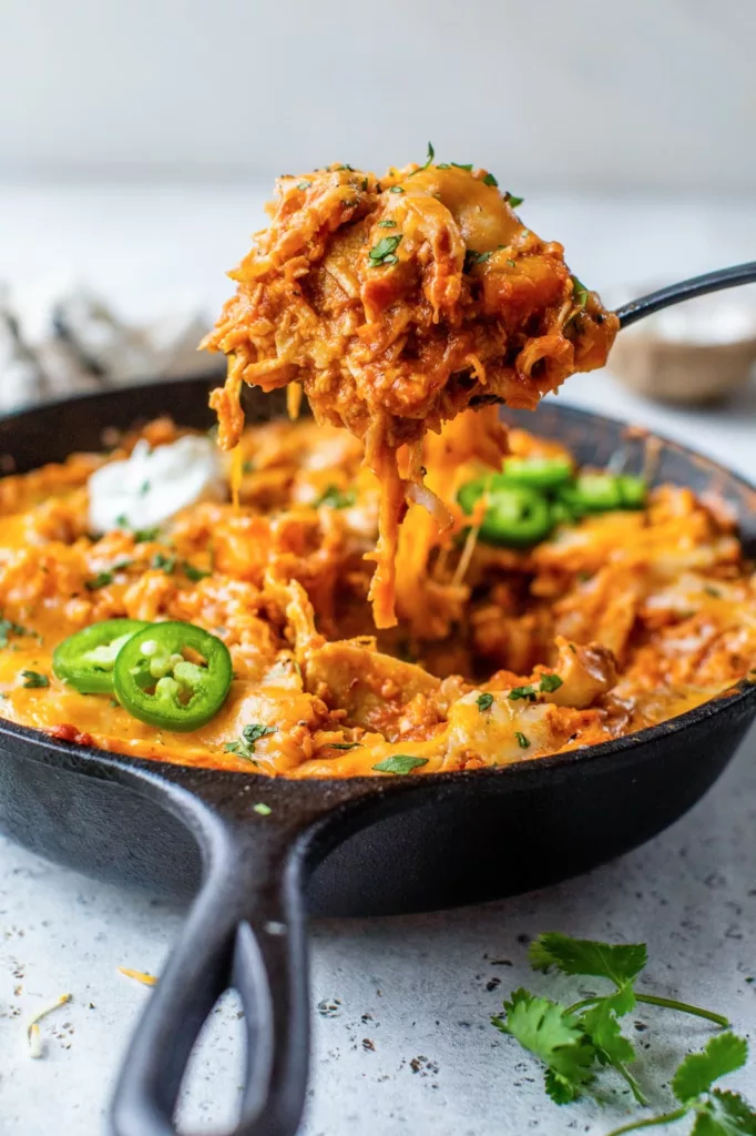 This recipe for leftover turkey enchiladas just requires one pan and skillet! An really delicious way to use up leftover veggies and turkey (or chicken)!