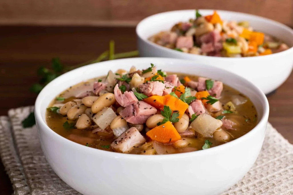 An hour may be spent making this quick and simple recipe for Ham and Bean Soup with leftover ham that you already have on hand!