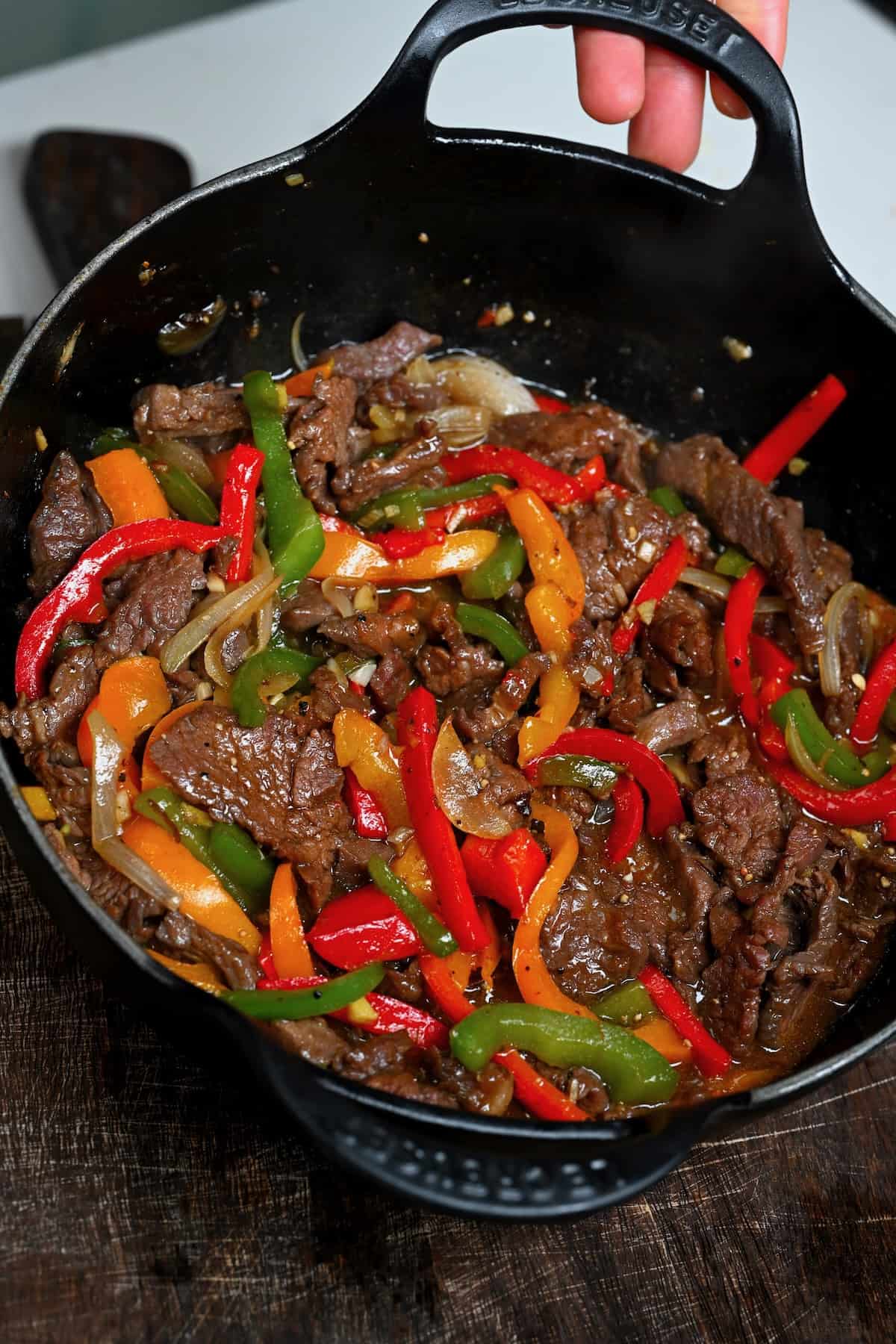 Thinly sliced flank steak is cooked in a flavorful sauce with red and green bell peppers in this pepper steak stir fry. A simple and quick dinner!

