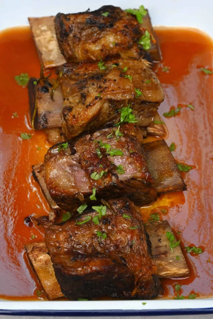 Easy to prepare and the ideal comforting midweek meal, these slow cooker short ribs include succulent, delicate meat that falls from the bone in a thick, hearty sauce.