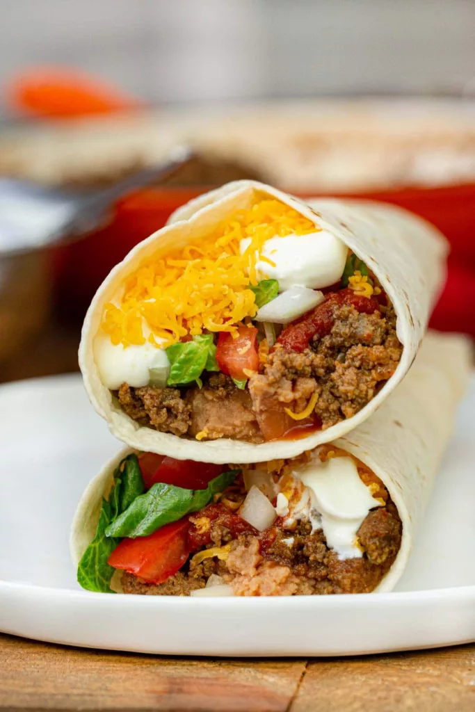 One of the greatest menu items at Taco Bell is the Taco Bell Burrito Supreme (Copycat), which is simple to prepare at home. with cheddar cheese, red sauce, meat, and beans.