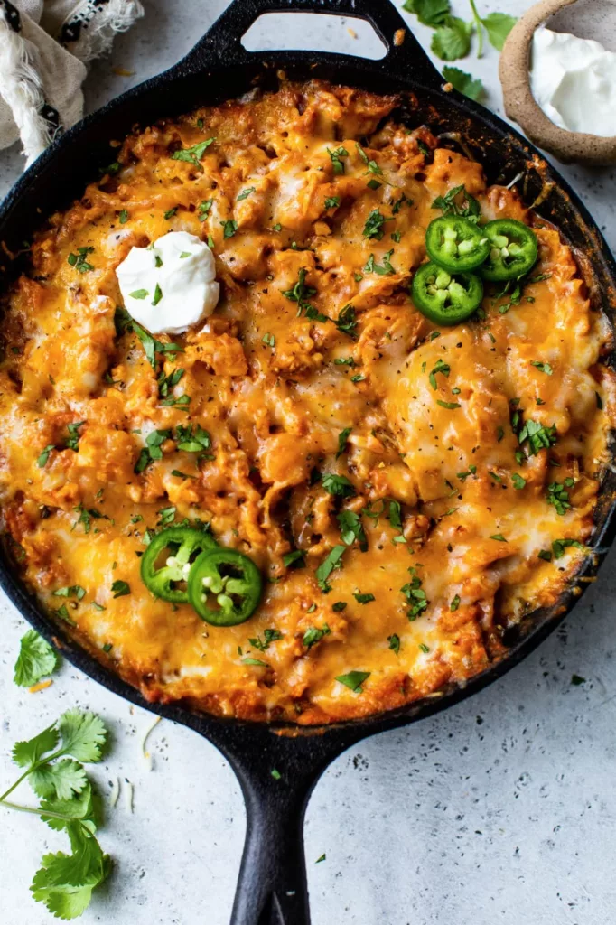 This recipe for leftover turkey enchiladas just requires one pan and skillet! An really delicious way to use up leftover veggies and turkey (or chicken)!