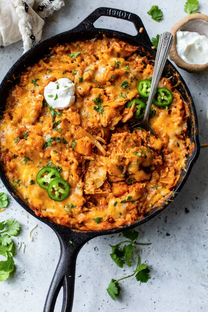 This recipe for leftover turkey enchiladas just requires one pan and skillet! An really delicious way to use up leftover veggies and turkey (or chicken)!